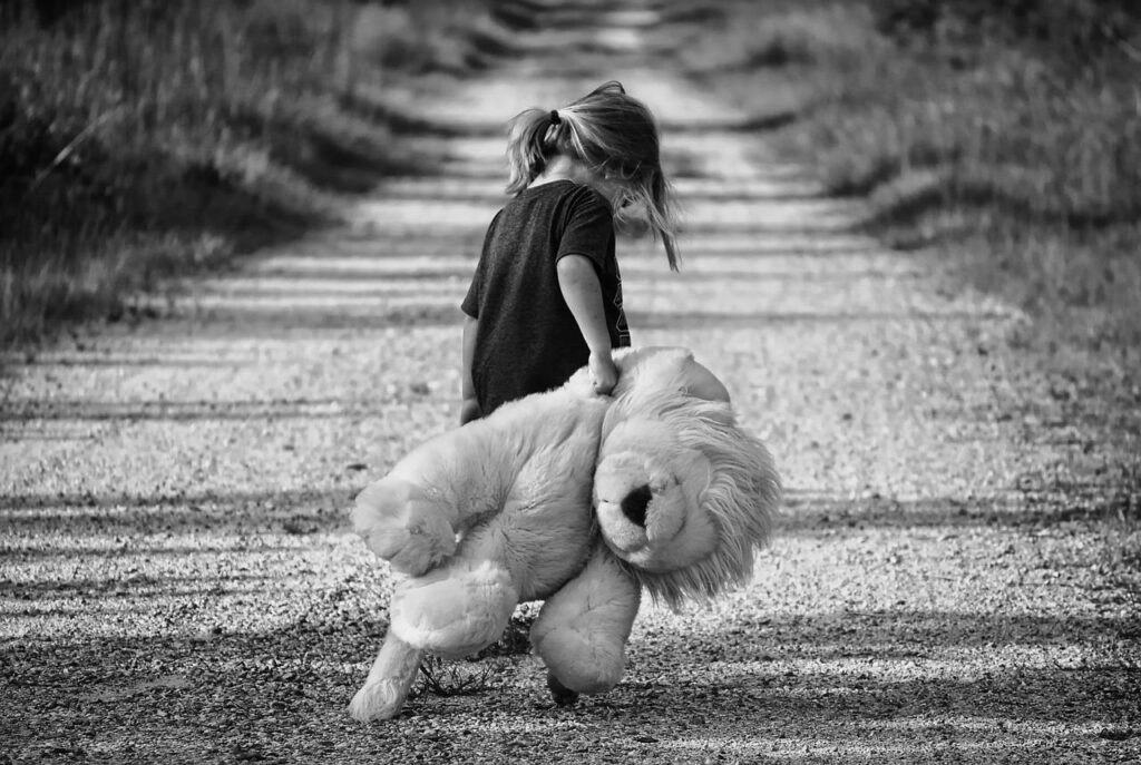Small Girl carrying Teddy bear (Home Remedies for Late Talking Child)